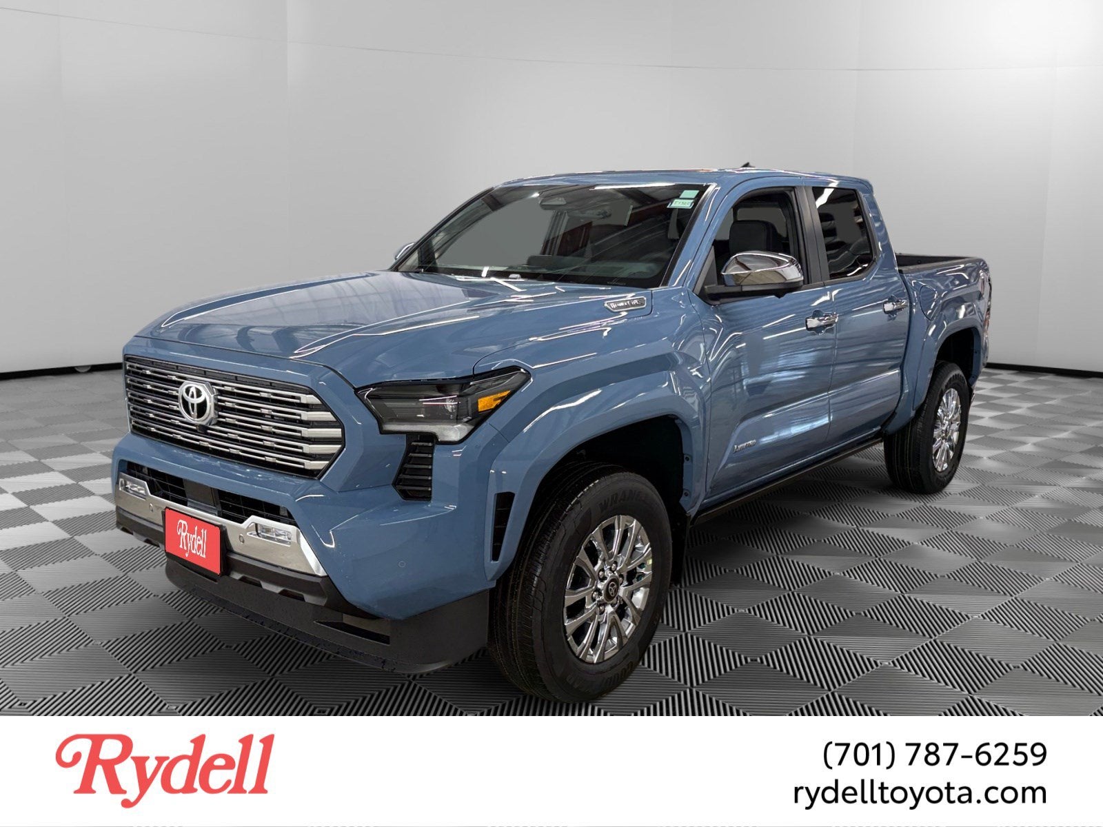2026 Toyota Tacoma i-FORCE MAX Tacoma Limited in Heritage Blue — front three-quarter view