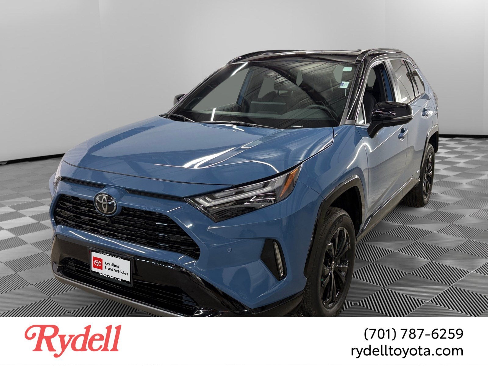 2025 Toyota RAV4 Hybrid XSE in Cavalry Blue Midnight — front three-quarter view
