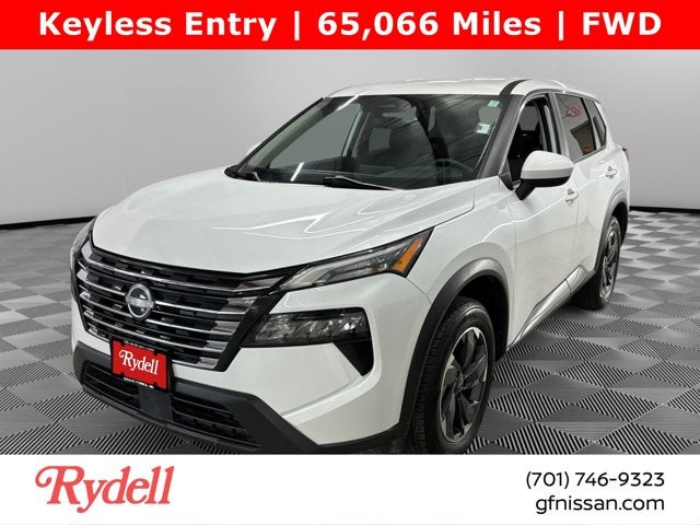 2024 Nissan Rogue SV in Everest White Pearl — front three-quarter view