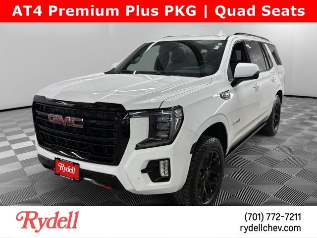 2023 GMC Yukon AT4 in Summit White — front three-quarter view