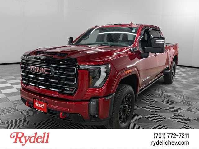 2024 GMC Sierra 3500HD AT4 in Volcanic Red Tintcoat — front three-quarter view